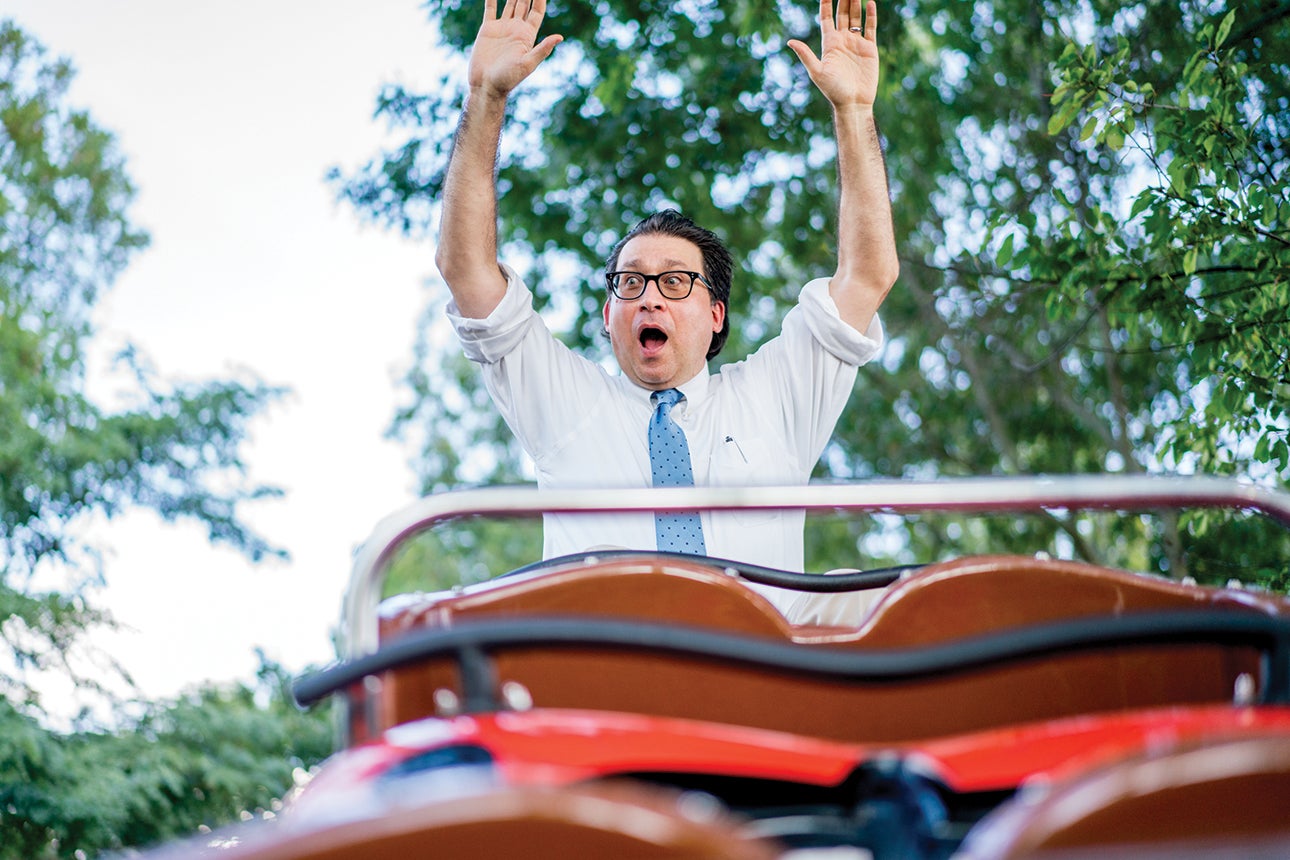 Martin Lewison rides a rollercoaster at Long Island amusement park Adventureland. 